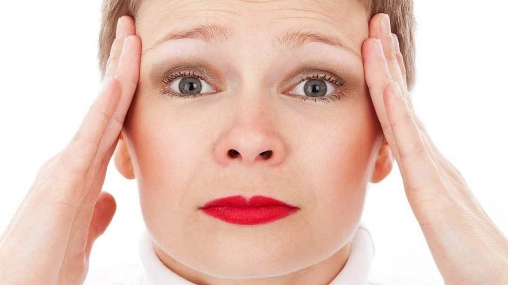 overwhelmed woman's face