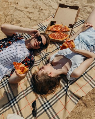 people eating pizza on a date